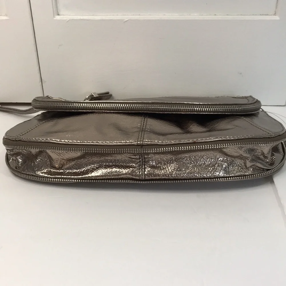 Price is firm NINE WEST Metallic Silver Zip Magnet Fold Clutch
